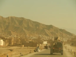 PULI KHUMRI, AFGHANISTAN, MAR 21, 2011: American military convoy travels through the town of Puli Khumri Afghanistan in Baghlan Province.