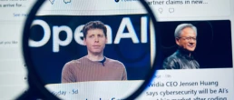 Close up view of a magnifying glass focusing on an online article featuring Sam Altman and the OpenAI logo on a digital display. Kolkata, West Bengal, India, September 12, 2026
